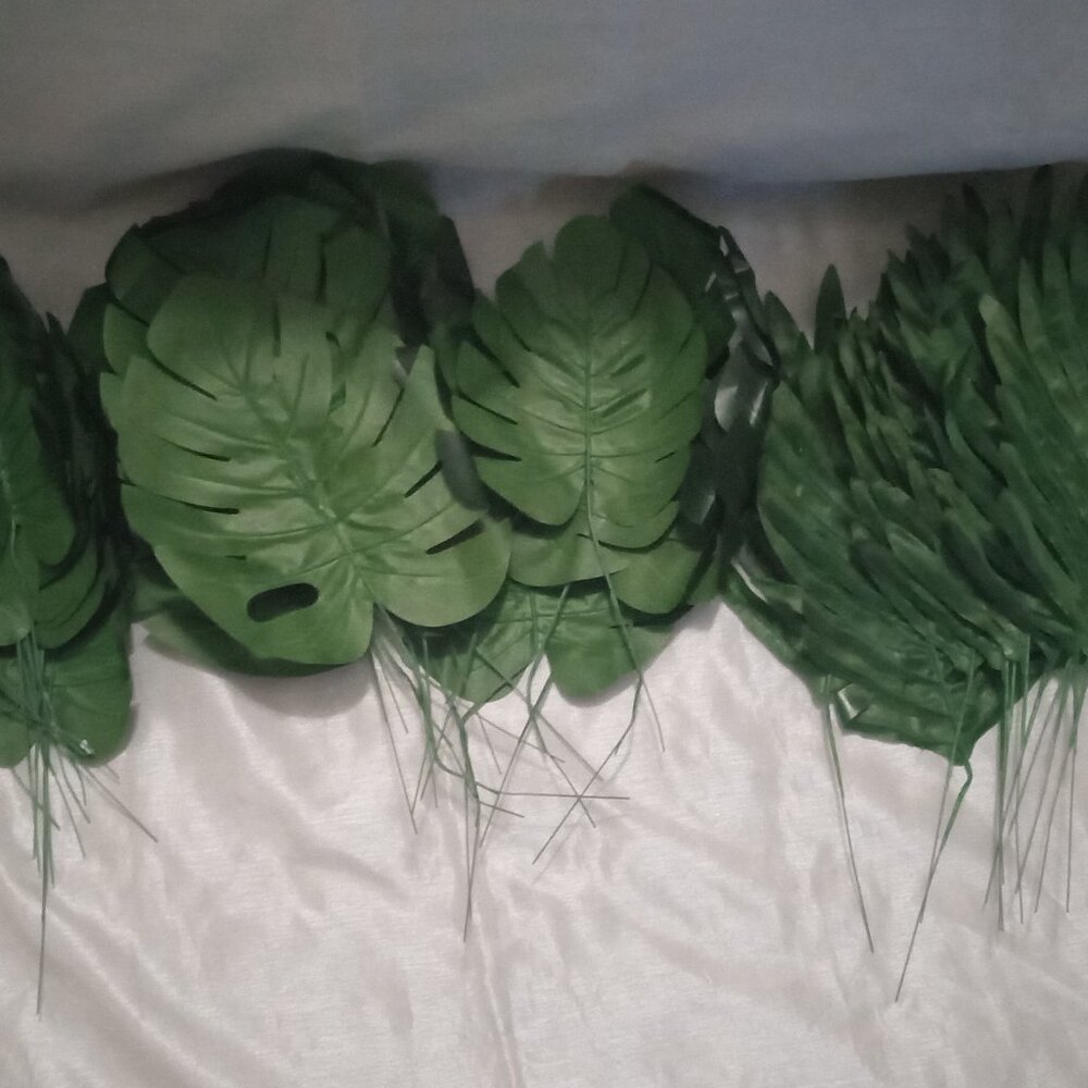various green plastic tropical Hawaiian leaves